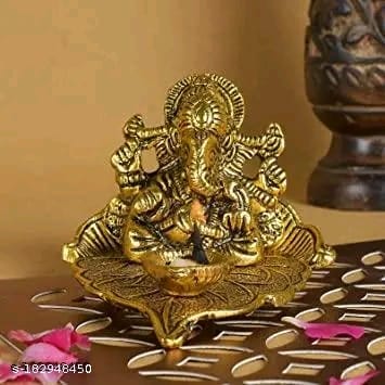 Golden Metal Handcrafted Lord Ganesha Idol with Diya on Leaf