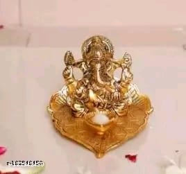 Golden Metal Handcrafted Lord Ganesha Idol with Diya on Leaf