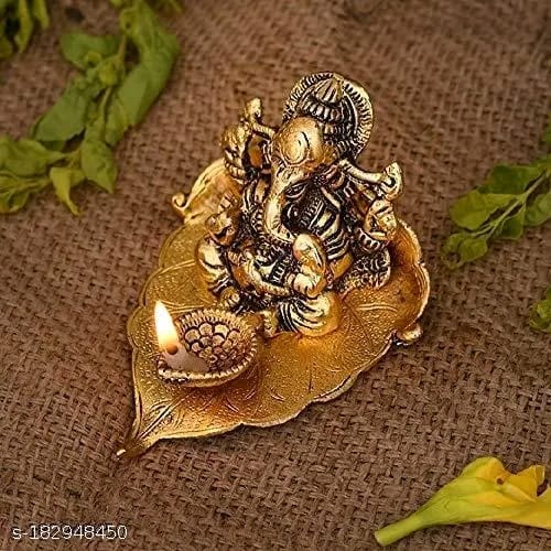 Golden Metal Handcrafted Lord Ganesha Idol with Diya on Leaf